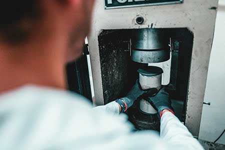 The compressive strength of the refined AI-generated formulas is tested. (Photo: Meta)