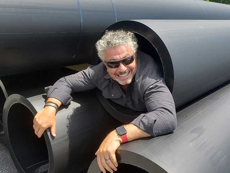 Quantum Loophole CEO Josh Snowhorn inside one of the 26-inch fiber conduits that will under the Potomac River in the company's new fiber ring. (Photo: Rich Miller)